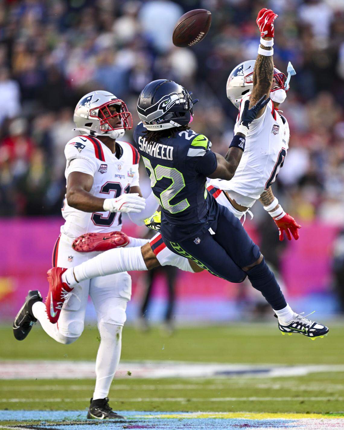 New England Patriots cornerback Christian Gonzalez (0) breaks up a pass intended for Seattle Seahawks wide receiver Rashid Shaheed (22) during the second quarter of Super Bowl LX at Levi's Stadium on Feb. 8, 2026 in Santa Clara, Calif. The pass fell incomplete.