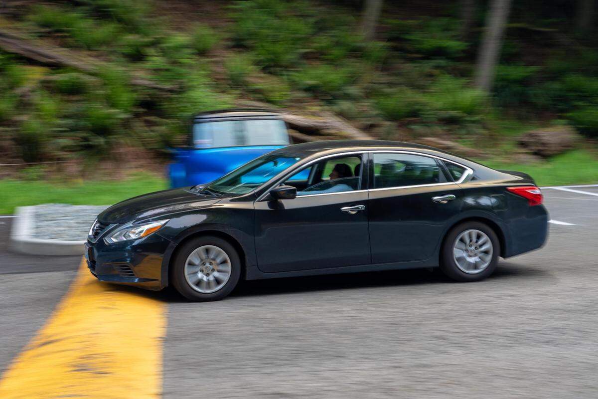 A car driving down the parking lot to reach Owen Beach in Tacoma Wash. on Wednesday June 1, 2022. In order to get to Owen Beach in a car, you have to drive down the parking lot and go over a series of speed bumps that many have complained are damaging their vehicles.