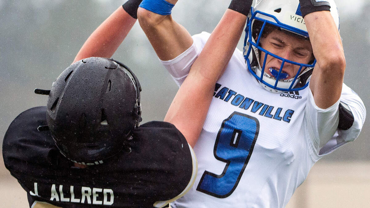 Eatonville wide receiver Jakob Lucht (9) attempts to catch a pass from quarterback Kevin Wulff as Royal defensive back Jace Allred (82) defends during the first quarter of the State 1A championship game on Saturday afternoon at Harry E. Lang Stadium in Lakewood.