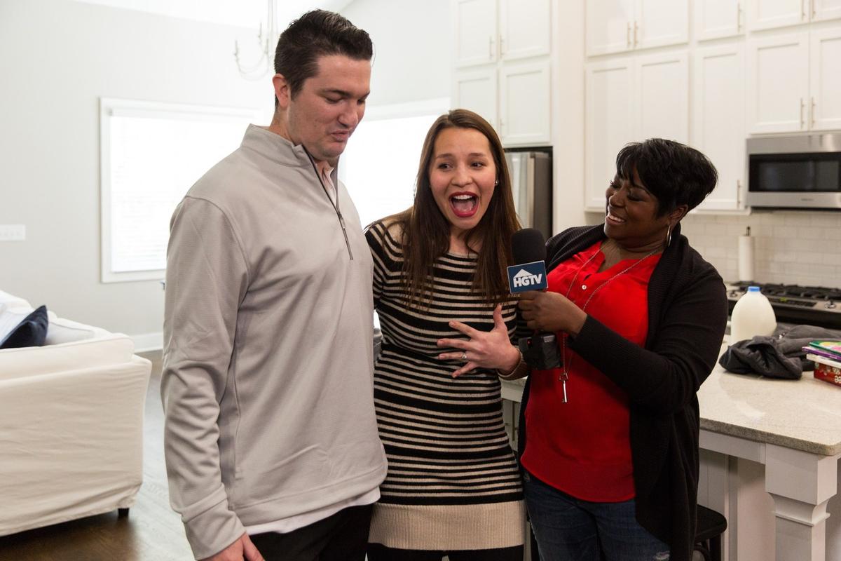 Emily Muniz, center, from suburban Nashville, was surprised by HGTV's Tiffany Brooks with the news that she is the winner of the HGTV Dream Home Giveaway 2018, located in Gig Harbor, Washington.
