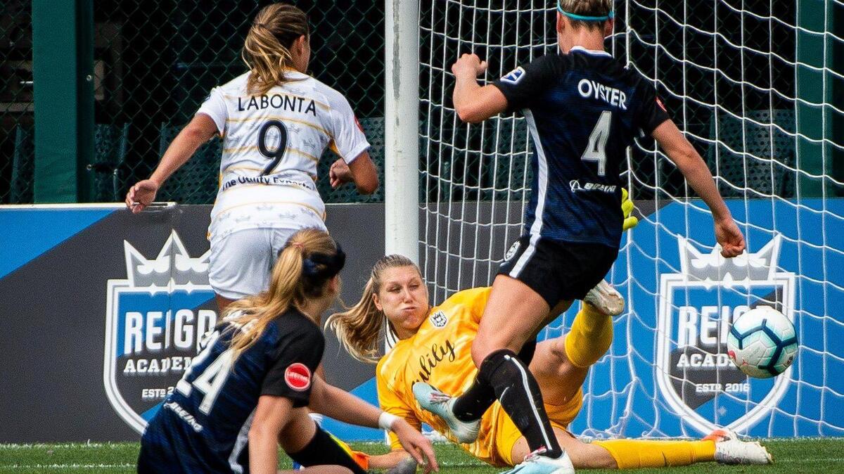 Utah Royals FC midfielder Lo’eau LaBonta (9) shoots, and scores a goal past Seattle Reign FC goalkeeper Casey Murphy (26) during the second half. The Reign FC played the Utah Royals in a National Women’s Soccer League match at Cheney Stadium in Tacoma, Wash., on Sunday, Aug. 11, 2019.