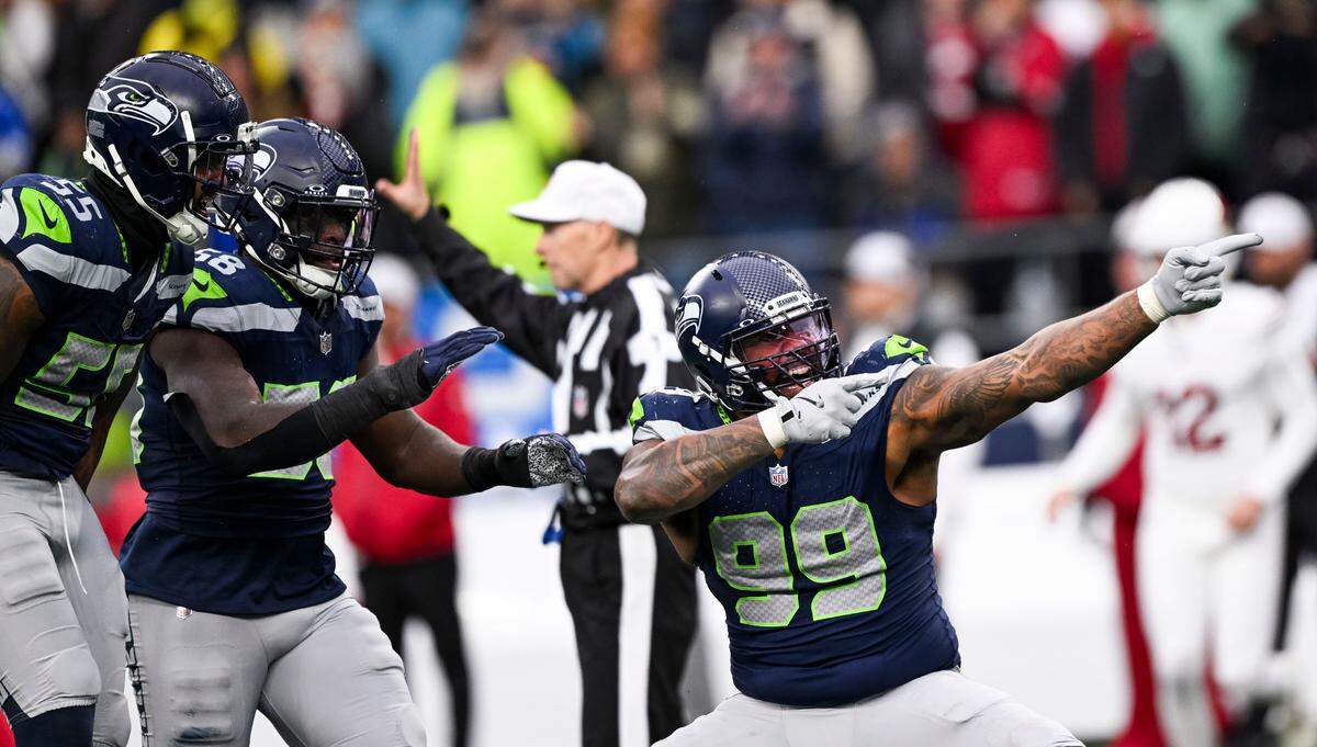 Seattle Seahawks defensive end Leonard Williams (99) reacts to a sack on Arizona Cardinals quarterback Kyler Murray (1) during the third quarter of the game at Lumen Field, on Sunday, Nov. 24, 2024, in Seattle, Wash.