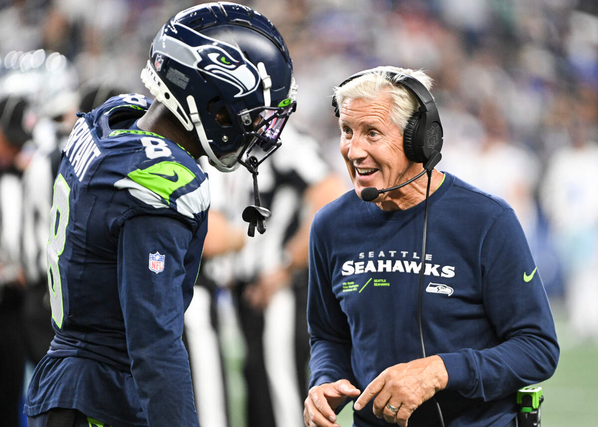 Seattle Seahawks head coach Pete Carroll talks to cornerback Coby Bryant (8) during the fourth quarter of the preseason game against the Dallas Cowboys at Lumen Field, Saturday, Aug. 19, 2023, in Seattle, Wash.