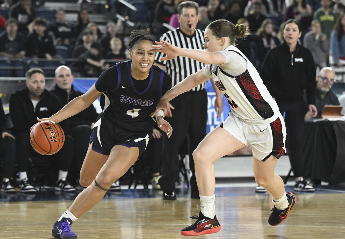 Sumner guard Kawehi Borden (4) pushes past Union point guard Kadee Spike (12) during the quarterfinal round of the 4A State Tournament at the Tacoma Dome, on Thursday, March 5, 2026, in Tacoma, Wash.