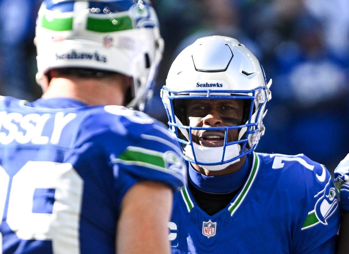 Seattle Seahawks quarterback Geno Smith (7) huddles before the play during the second quarter of the game against the Cleveland Browns at Lumen Field, Sunday, Oct. 29, 2023, in Seattle, Wash.