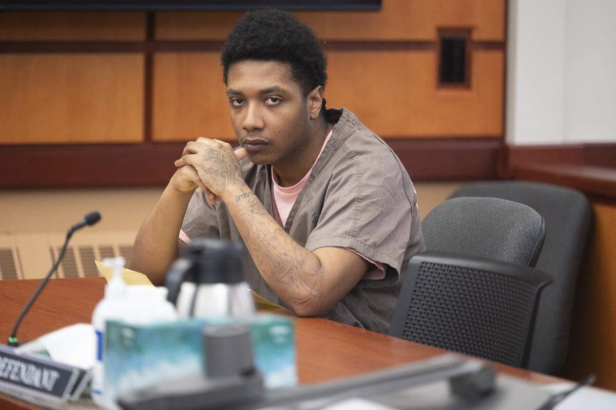 Michael Miller-Jimerson, 26, sits in court ahead of his sentencing hearing on Tuesday, Jan. 6, 2026, at Pierce County Superior Court in Tacoma, Wash. Miller-Jimerson plead guilty to second-degree murder for directing three teenagers in the March 19, 2022 robbery of the World of Weed dispensary in Tacoma, where an employee, 29-year-old Jordan Brown, was shot and killed.