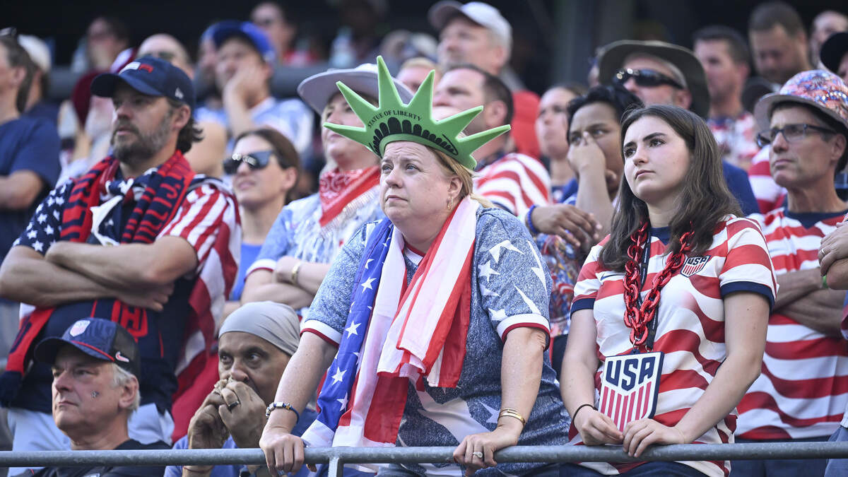 United States of America fans look solemn in the Lumen Field stands after a third Belgium goal during a round of sixteen FIFA World Cup match on Monday, July 6, 2026, in Seattle.