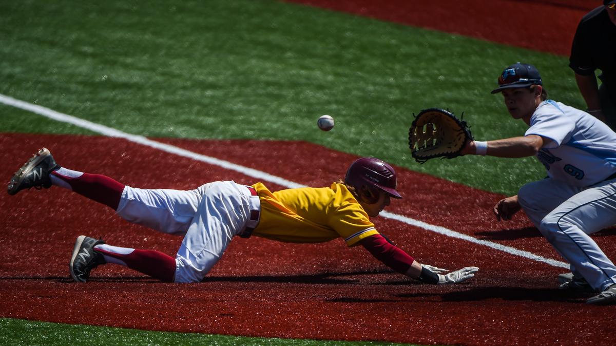 A Capital High School player dives back to first base during a game against Gig Harbor in this file photo from 2019. Spring sports did not play during the 2020 season due to COVID-19.