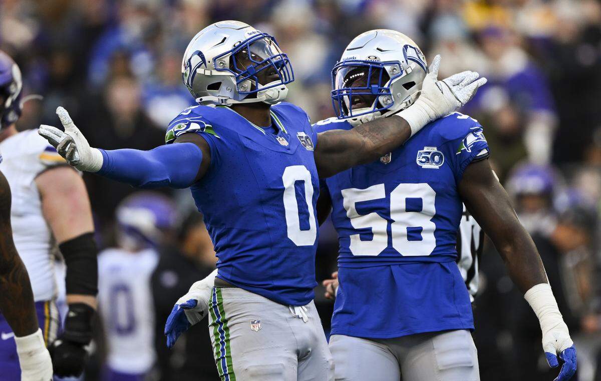 Seattle Seahawks defensive end DeMarcus Lawrence (0) reacts to a sack on Minnesota Vikings quarterback Max Brosmer (12) during the second quarter of the game at Lumen Field, on Sunday, Nov. 30, 2025, in Seattle.