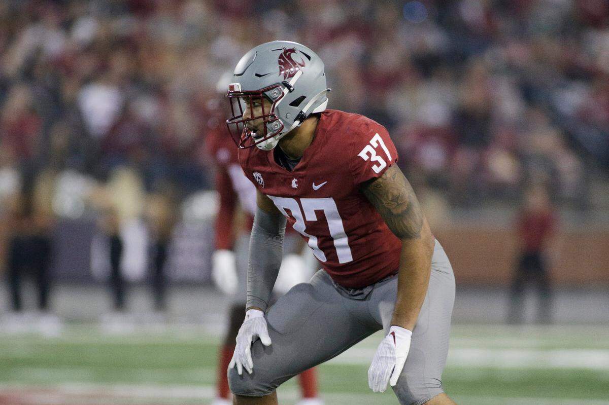 Washington State linebacker Justus Rogers lines up for a play during the second half of an NCAA college football game against Utah State, Saturday, Sept. 4, 2021, in Pullman, Wash. (AP Photo/Young Kwak)