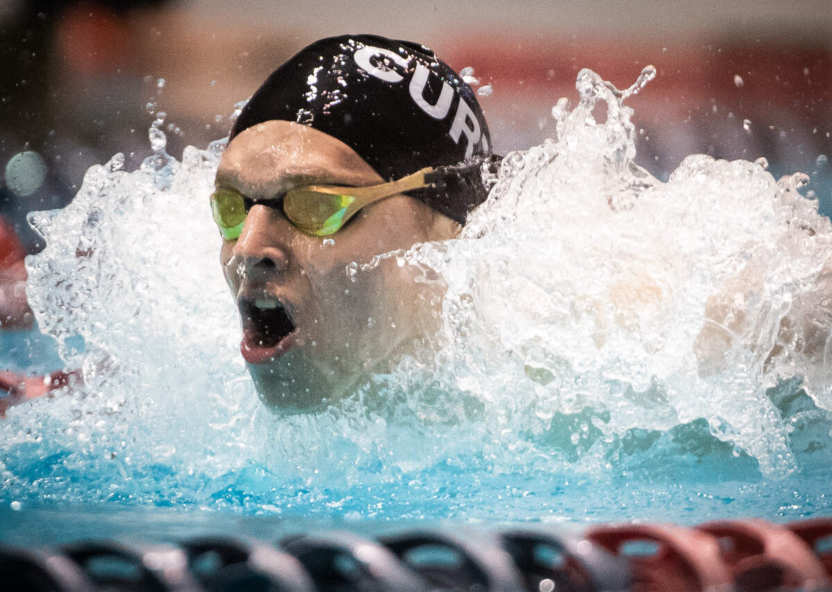 Curtis’ Patrick Keough competes in the 100-yard butterfly final during the 4A State Swim and Dive Championship at the King County Aquatic Center in Federal Way, Wash., on Saturday, Feb. 22, 2020.
