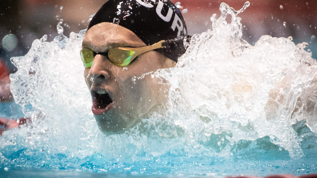 Curtis’ Patrick Keough competes in the 100-yard butterfly final during the 4A State Swim and Dive Championship at the King County Aquatic Center in Federal Way, Wash., on Saturday, Feb. 22, 2020.