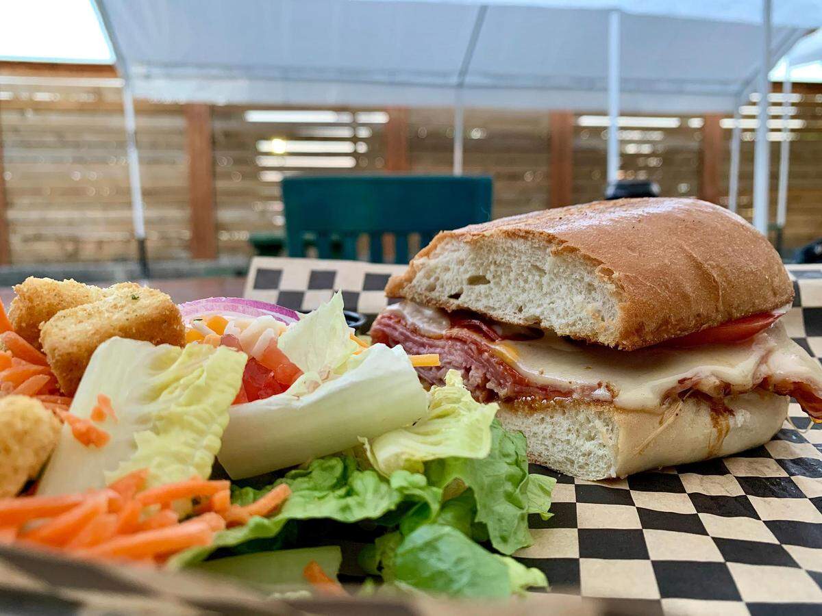 Without live music, at least we can have the Peterson brothers’ sandwiches at The Valley on Puyallup Ave. in Tacoma. Here is the Brutus, their take on an Italian, enjoyed on their back tented patio with a fire pit.