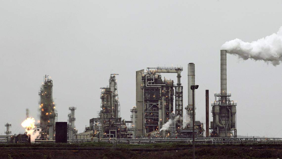 This April 2, 2010 photo shows a Tesoro Corp. refinery, including a gas flare flame that is part of normal plant operations, in Anacortes.