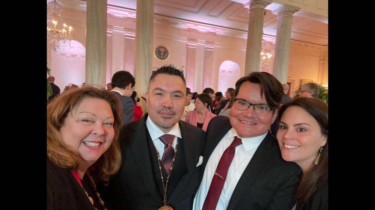 Members of the National Indian Health Board attend the signing of a historic executive order to make healthcare more accessible for American families Tuesday, April 5. According to the Board, the act contributed to roughly 300,000 uninsured American Indians and Alaska Natives obtaining health coverage by 2020.