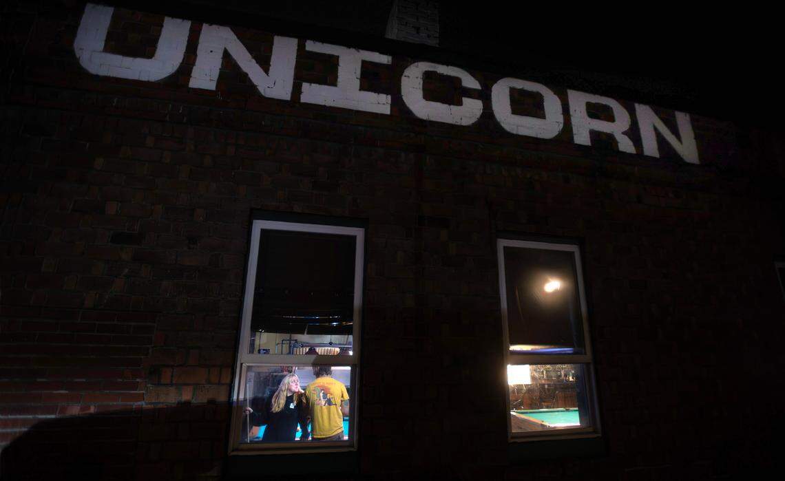 Pool players at the Unicorn Sports Bar & Grill in Ruston, Washington, Friday, Oct. 25, 2024.