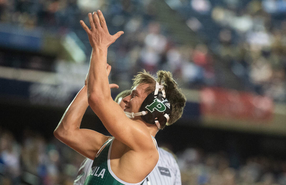 Peninsula’s Nola Casey celebrates winning the 3A 160 pound championship during day two of Mat Classic XXXII at the Tacoma Dome in Tacoma, Wash., on Saturday, Feb. 22, 2020.