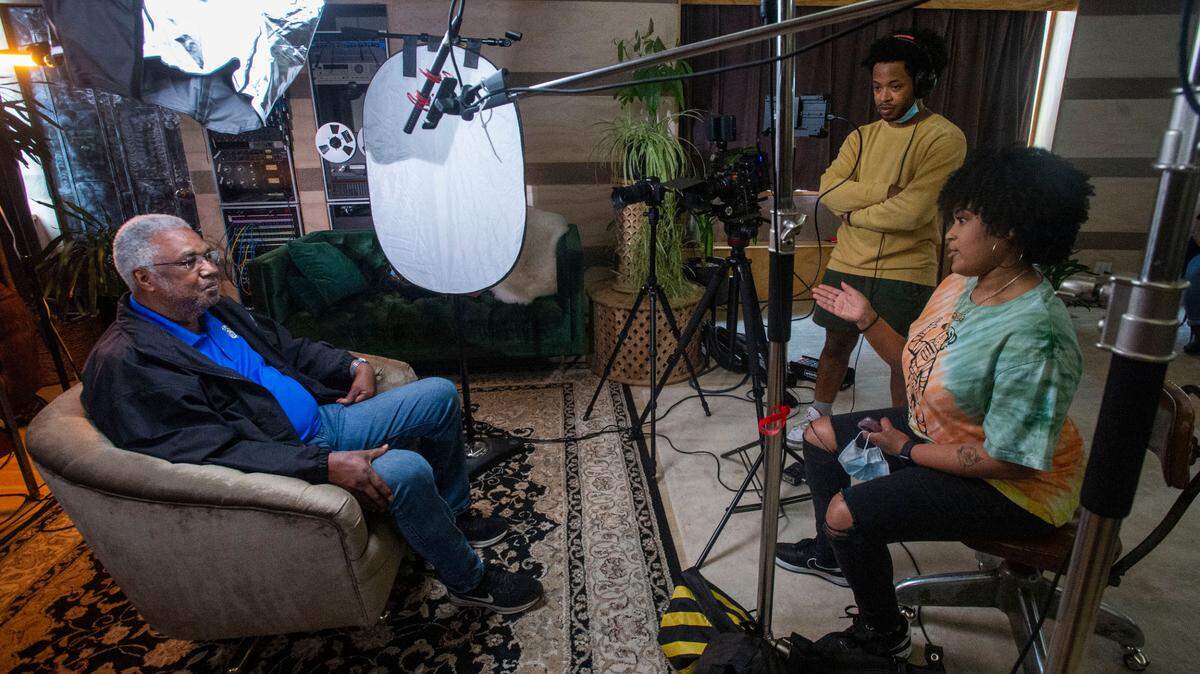 Filmmakers and siblings Jazmyn and Aaron Pratt interview Metro Parks Board Commissioner Aaron Pointer about Judge Jack Tanner’s legacy and the naming of a park in his honor. The interview about the Black judge is one in a series of Black history videos that will appear as an exhibit at the Tacoma Art Museum in July. Photo taken at Alma Mater in Tacoma on Sunday, June 13, 2021.