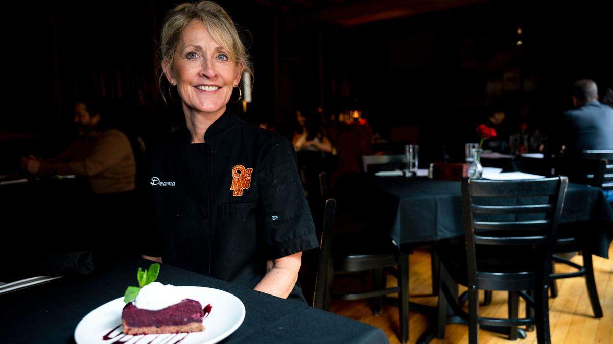 Chef Deanna Harris-Bender sits in the upstairs section of Over the Moon Cafe, her intimate restaurant at 709 Opera Alley in Tacoma, Wash.