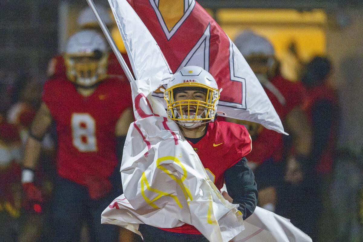 Mount Tahoma running back Aziel Salima (12) leads the team’s entrance onto the field before their game against Lincoln on Saturday, Nov. 22, 2025, in Tacoma, Wash.