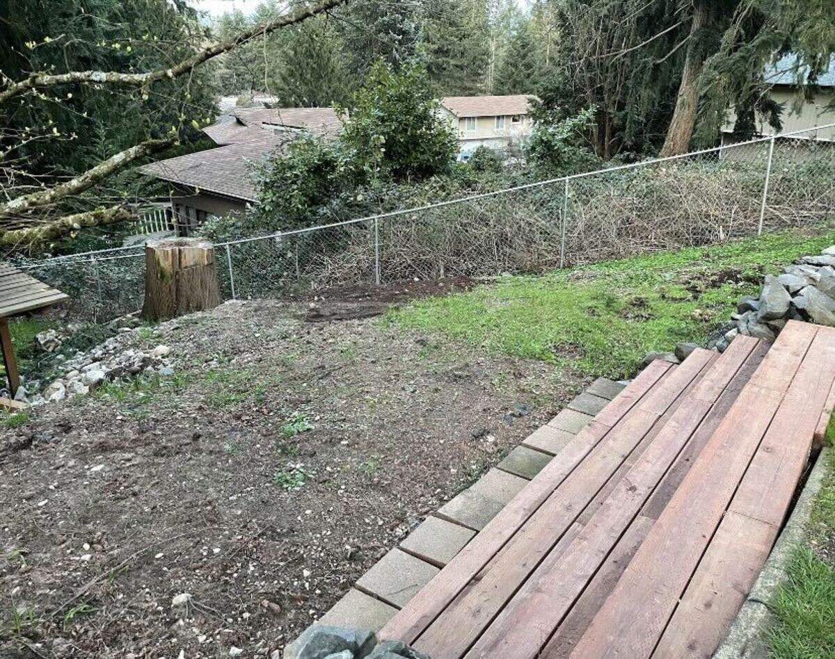 The playset build at the Gardner family’s backyard was challenging due to its hilly nature. Crews had to build a retaining wall before placing the playset.