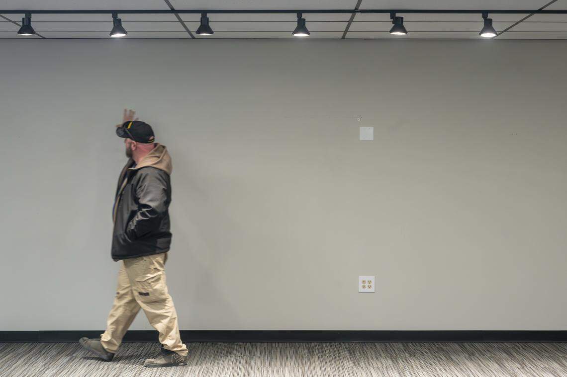 Brandon Simmons, founder and board chair of the Skoolie Foundation, talks through future plans for a thrift store at a building recently purchased by the foundation on Monday, March 2, 2026, in Puyallup, Wash.