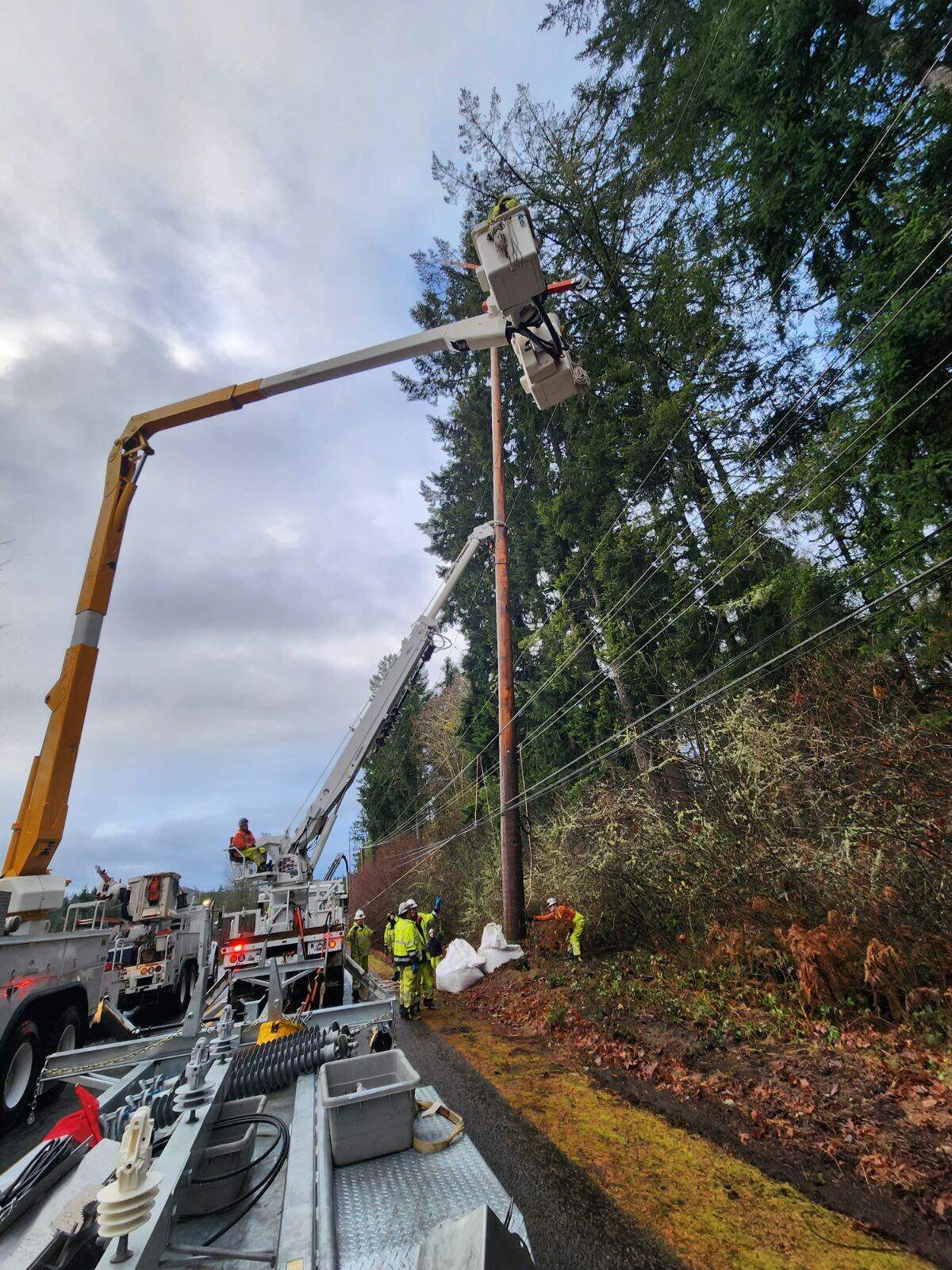 Peninsula Light Co. makes repairs to a transmission pole which was damaged in a car wreck. About 3,000 residents are without power until it’s repaired.