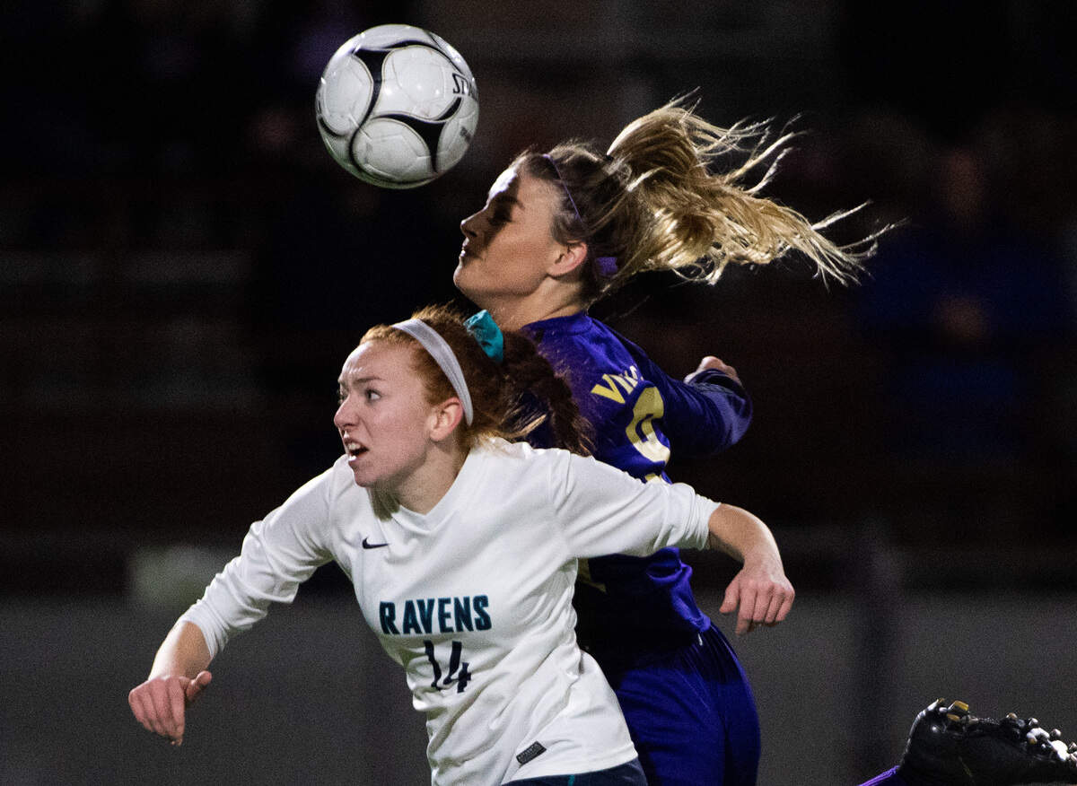 Puyallup’s Sydney Evans and Auburn Riverside’s Sydney Wate go after a loose ball during the second half. Puyallup played Auburn Riverside in the WIAA 4A Girls Soccer State Championship game at Sparks Stadium in Puyallup, Wash., on Saturday, Nov. 23, 2019.