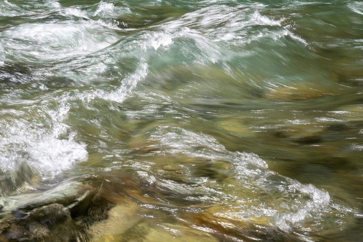 Water flows quickly over rocks in the Ohanepecosh River, a river fed by Mount Rainier’s glaciers, on Friday, June 6, 2025, near the La Wis Wis Campgrounds at Mount Rainier National Park.