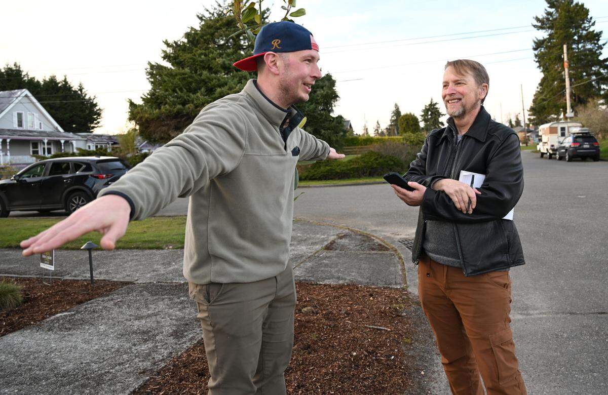 News Tribune reporter Craig Sailor, right, talks with Tacoma resident Kevin Larson about his dangerous encounter with an angry barred owl in March of 2024 in Tacoma.