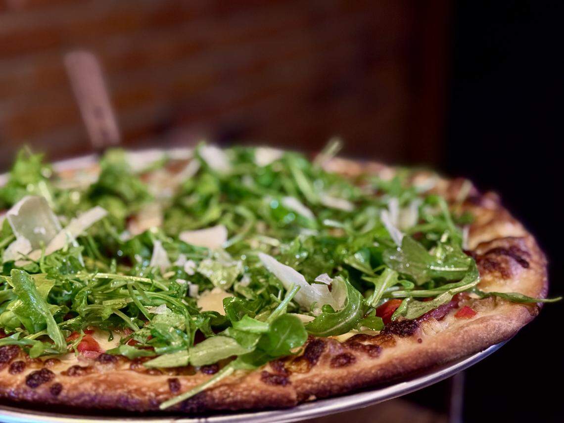 Mikey’s Public House & Frog Bar replaced Zeeks Pizza in downtown Tacoma. Order New York-style pies such as this 12-inch with lemony arugula, prosciutto and roasted red peppers, plus slices at lunch.