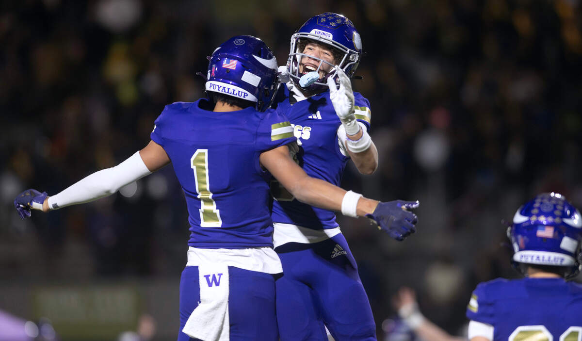 Puyallup’s J’Isaiah Mitchell (1) and Jayden Woodland celebrate an apparent touchdown catch during Friday night’s football game at Sparks Stadium in Puyallup, Washington, Oct. 25, 2024. The touchdown was nullified by offensive and defensive pass interference. Puyallup won the game, 49-35.