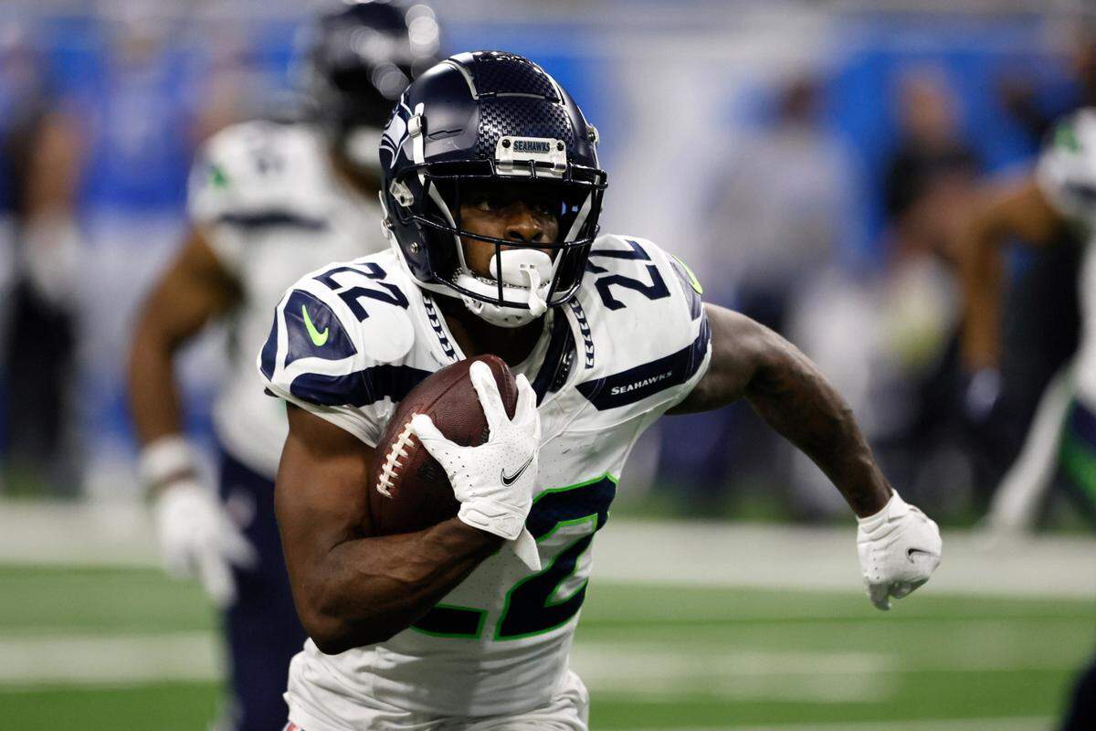 Seattle Seahawks cornerback Tre Brown (22) returns an interception 40 yards for a touchdown during the second half of an NFL football game against the Detroit Lions, Sunday, Sept. 17, 2023, in Detroit. (AP Photo/Duane Burleson)