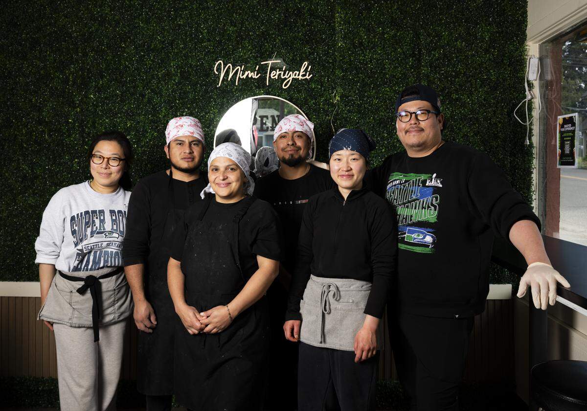 Co-owners, Sujin Chang, left, and David Chang, right, pose with the staff at Mimi's Teriyaki #2, on Friday, May 8. After a few years running a restaurant in Burien, they snagged this opportunity in Tacoma and have drawn crowds to the South End for a contemporary take on teriyaki.