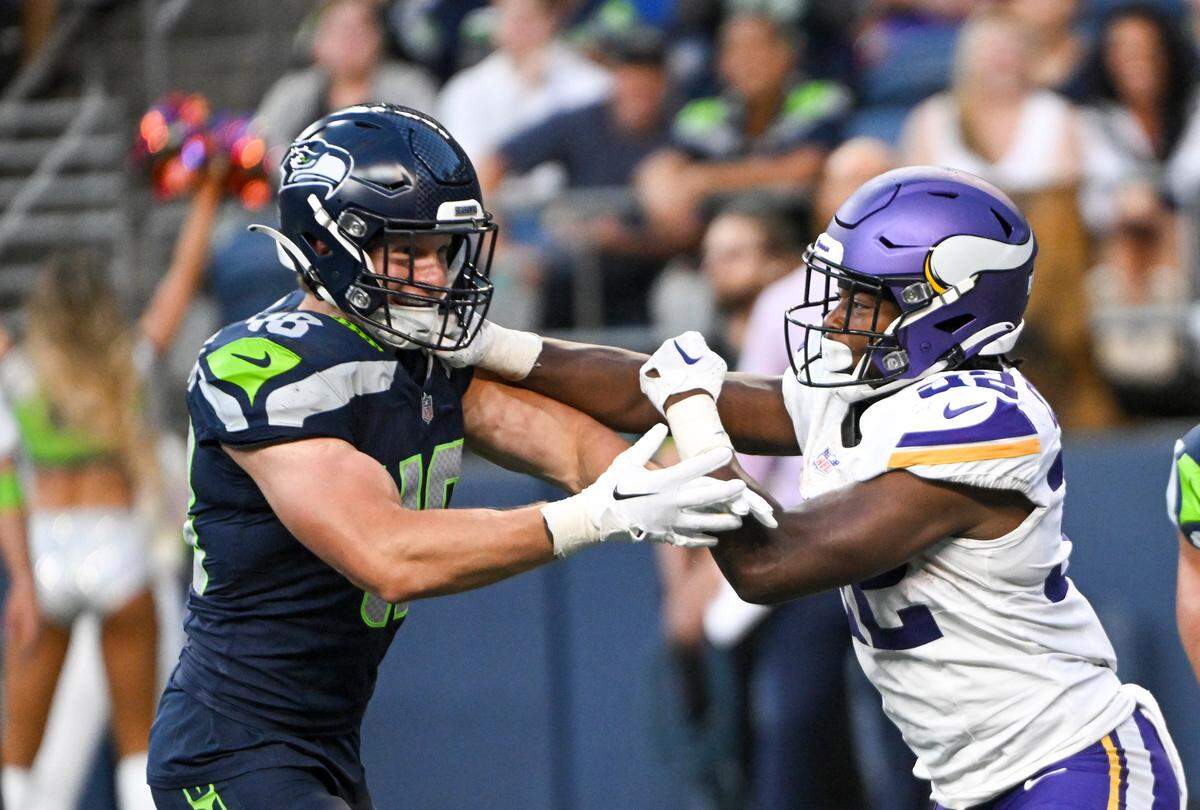 Seattle Seahawks linebacker Ben Burr-Kirven (48) blitzes against Minnesota Vikings running back Ty Chandler during the second quarter of the preseason game at Lumen Field, Thursday, Aug. 10, 2023, in Seattle. Burr-Kirven was playing his first game since a major knee injury and nerve damage in a preseason game Aug. 21, 2021.