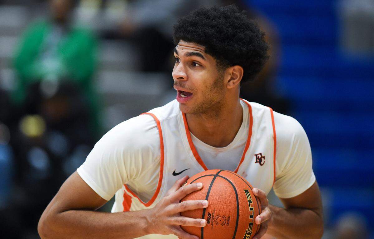Eastside Catholic’s Jacob Cofie (5) rebounds during the boys basketball game against Richland in The Dream Showcase, on Monday, Jan. 15, 2024, in Federal Way, Washington.