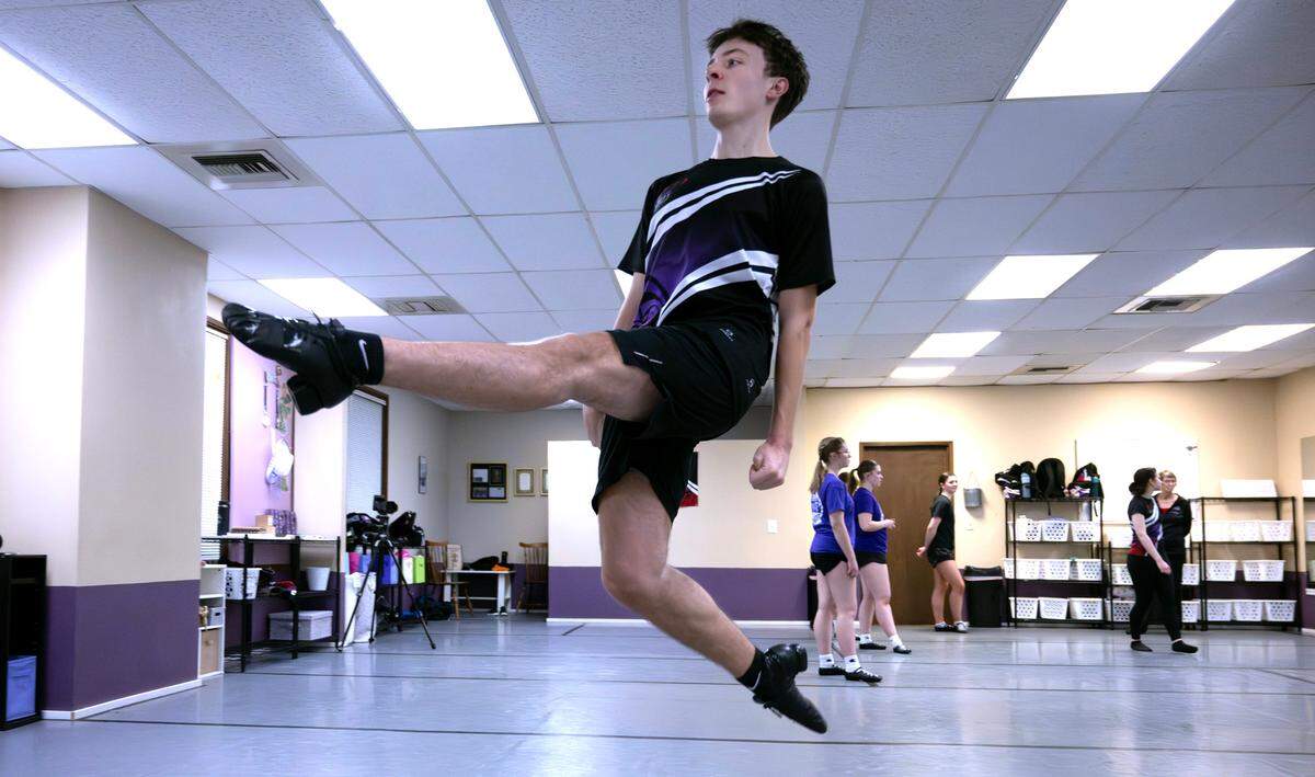 Kaden Scheller, a senior at Bellarmine Prep High School from Gig Harbor, leaps through Irish dance practice at the Haley Prendergast School of Irish Dance in Olympia, Washington, on Tuesday, Jan. 21, 2025.