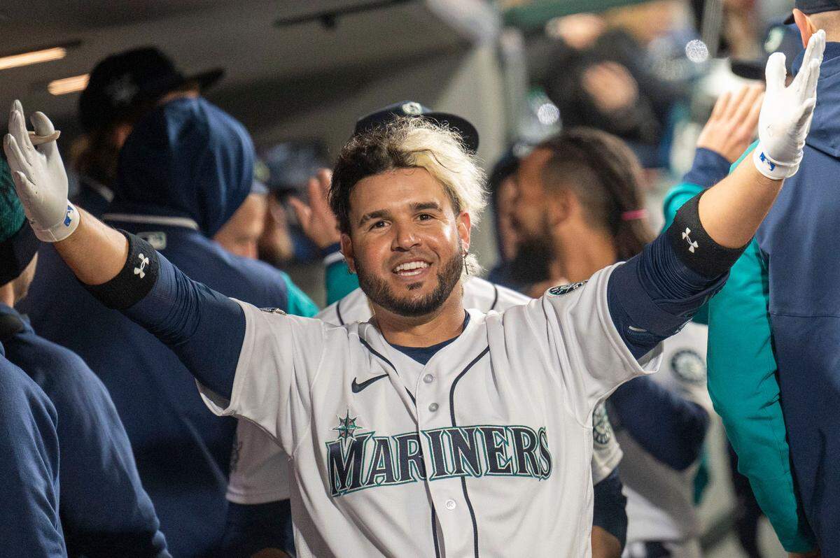 Seattle Mariners third baseman Eugenio Suarez (28) celebrates after hitting a 2-run homer in the bottom of the eighth inning of the home opener at T-Mobile Park in Seattle on Friday, April 15, 2022. The Seattle Mariners beat the Houston Astros, 11-1.
