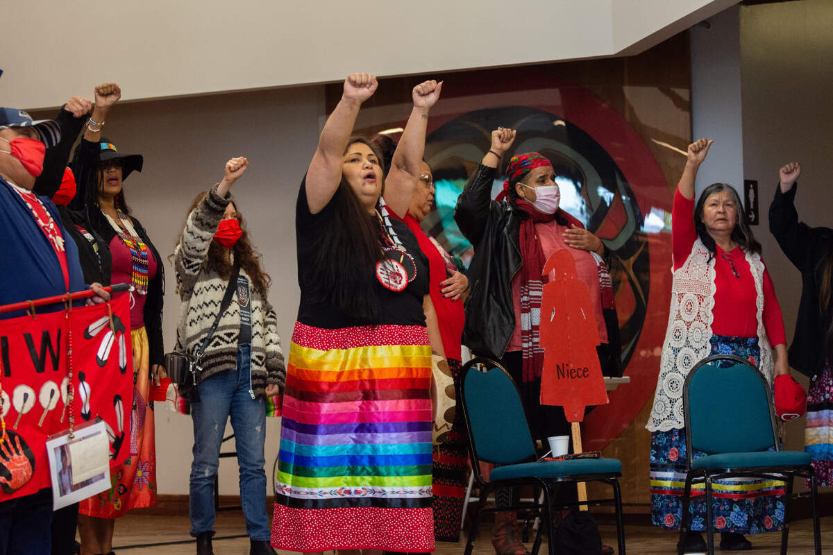 Roxanne White, founder of the survivor-led grassroots organization Missing and Murdered Indigenous Women, People and Families, center, stands in solidarity with survivors and families at the National Day for Awareness and Healing for Missing and Murdered Indigenous Women, People and Families Saturday, May 7, at Daybreak Star Indian Cultural Center in Seattle.