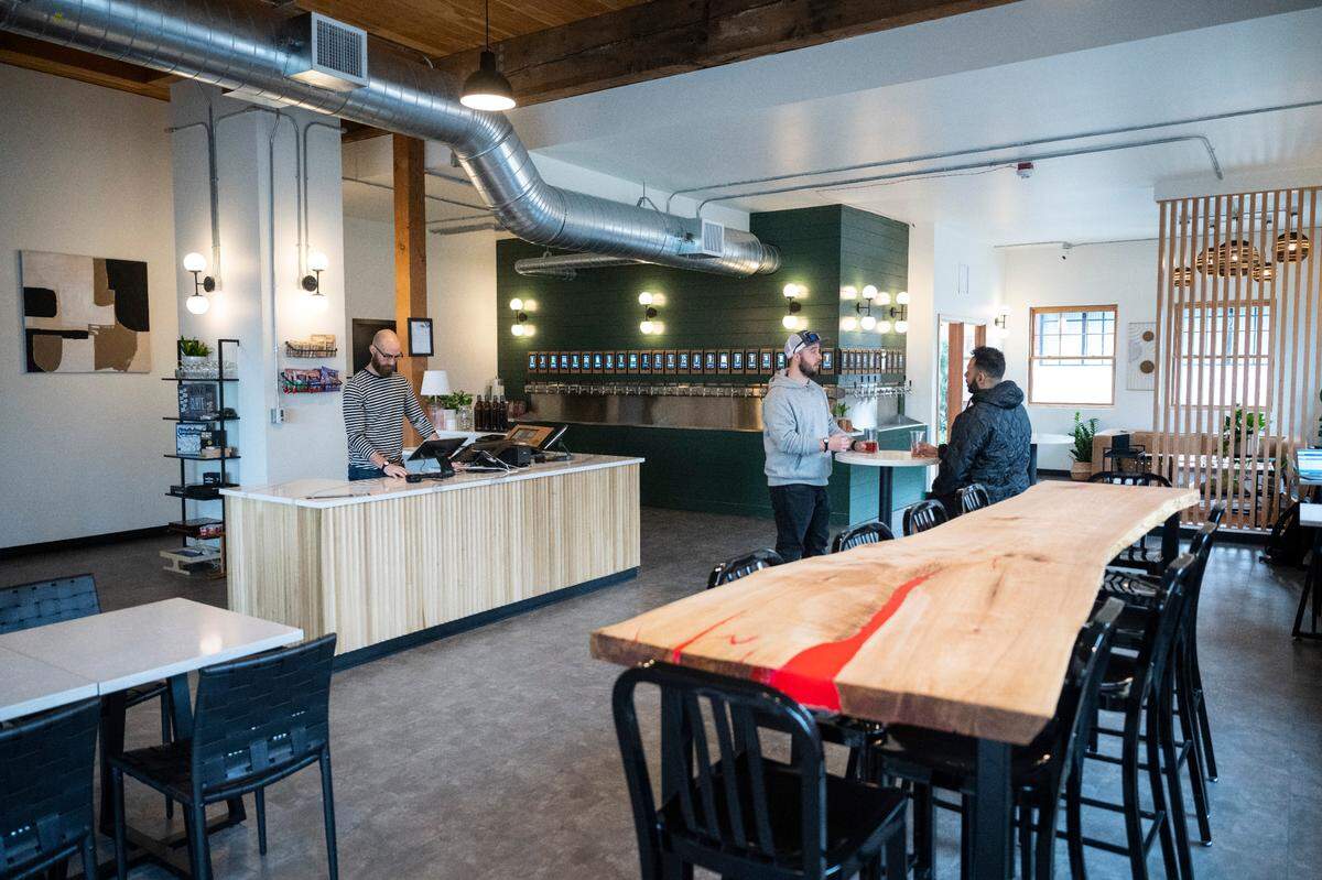 Third Place Cooperative designed a space that’s airy and minimalist. The Wunders built the communal table themselves from live-edge wood sourced from a tree at her childhood home near Seattle.