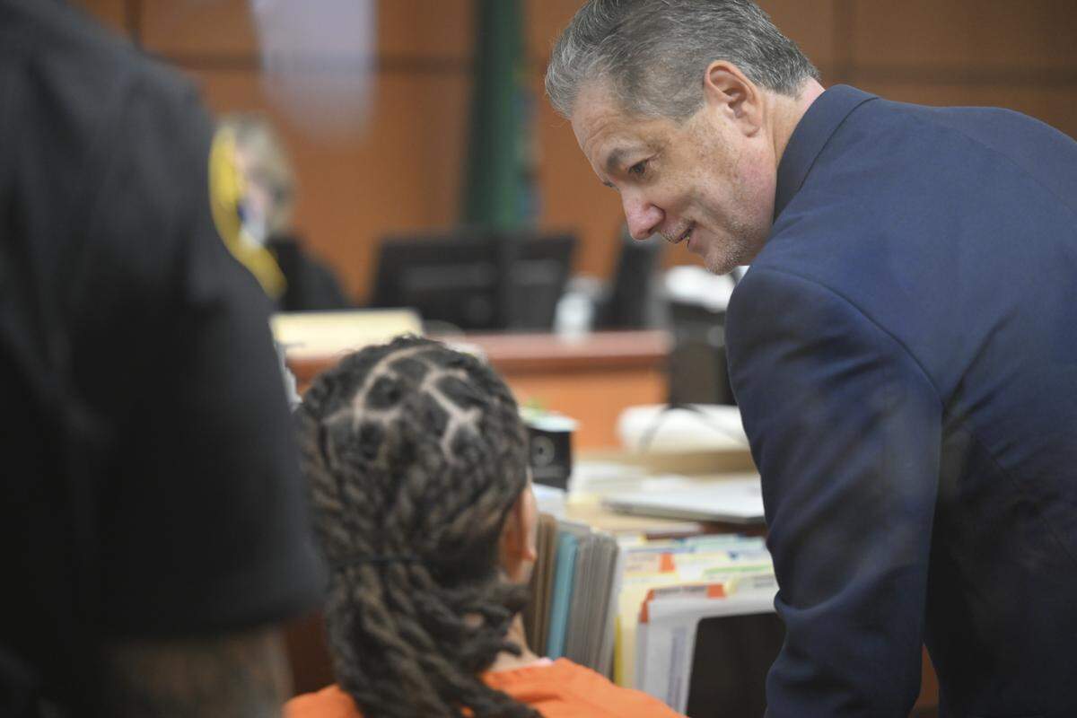Kai Domonic Butler, 29, speaks to defense attorney, James White during Butler's arraignment on charges related to the 2024 death of his former girlfriend, Tashylah Combs, on Thursday, April 2, 2026, at Pierce County Superior Court in Tacoma, Wash. Butler is charged with second-degree murder, first-degree manslaughter, second-degree assault, fourth-degree assault, unlawful imprisonment and first-degree criminal mistreatment.