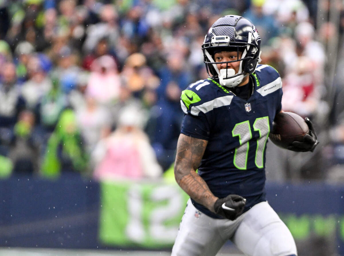 Seattle Seahawks wide receiver Jaxon Smith-Njigba (11) picks up from yards after the catch during the first quarter of the game against the Washington Commanders at Lumen Field, on Sunday, Nov. 12, 2023, in Seattle, Wash.