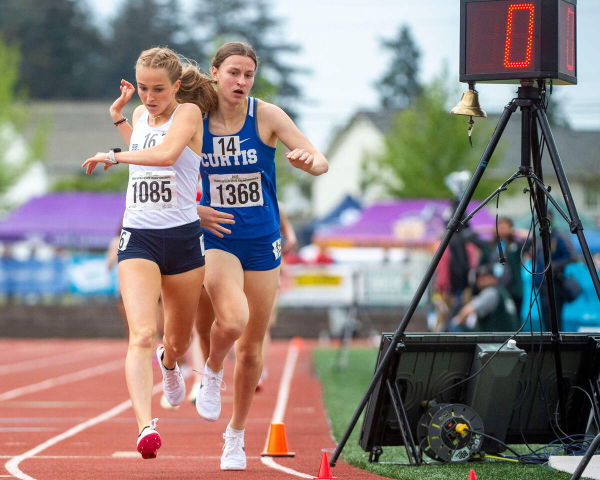 Bellarmine Prep’s Ella Borsheim (left) edges out Curtis’ Eliza White to win the 4A girls 1600-meters at the State 2A, 3A, 4A track and field championships on Thursday, May 26, 2022, at Mount Tahoma High School in Tacoma Wash.