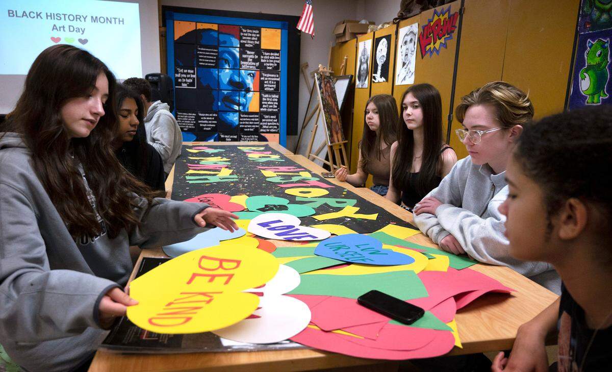 Members of the Gig Harbor High School prepare Black History Montyh posters during the weekly meeting of the Black Student Union at Gig Harbor High School in Gig Harbor, Washington, on Tuesday, Feb. 7, 2023.