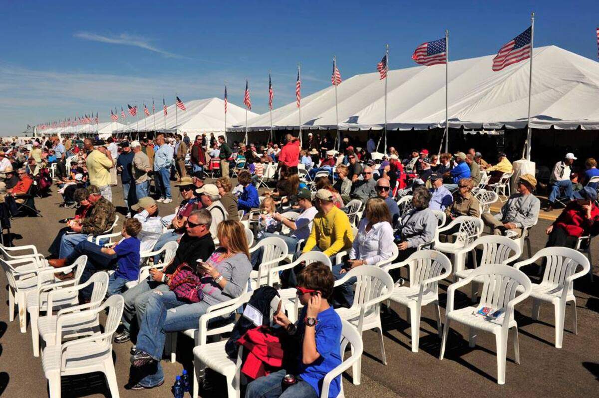 A crowd waits for the air show on the tarmac at the Tacoma Narrows Airport for the 7th Annual Wings & Wheels event in 2017.