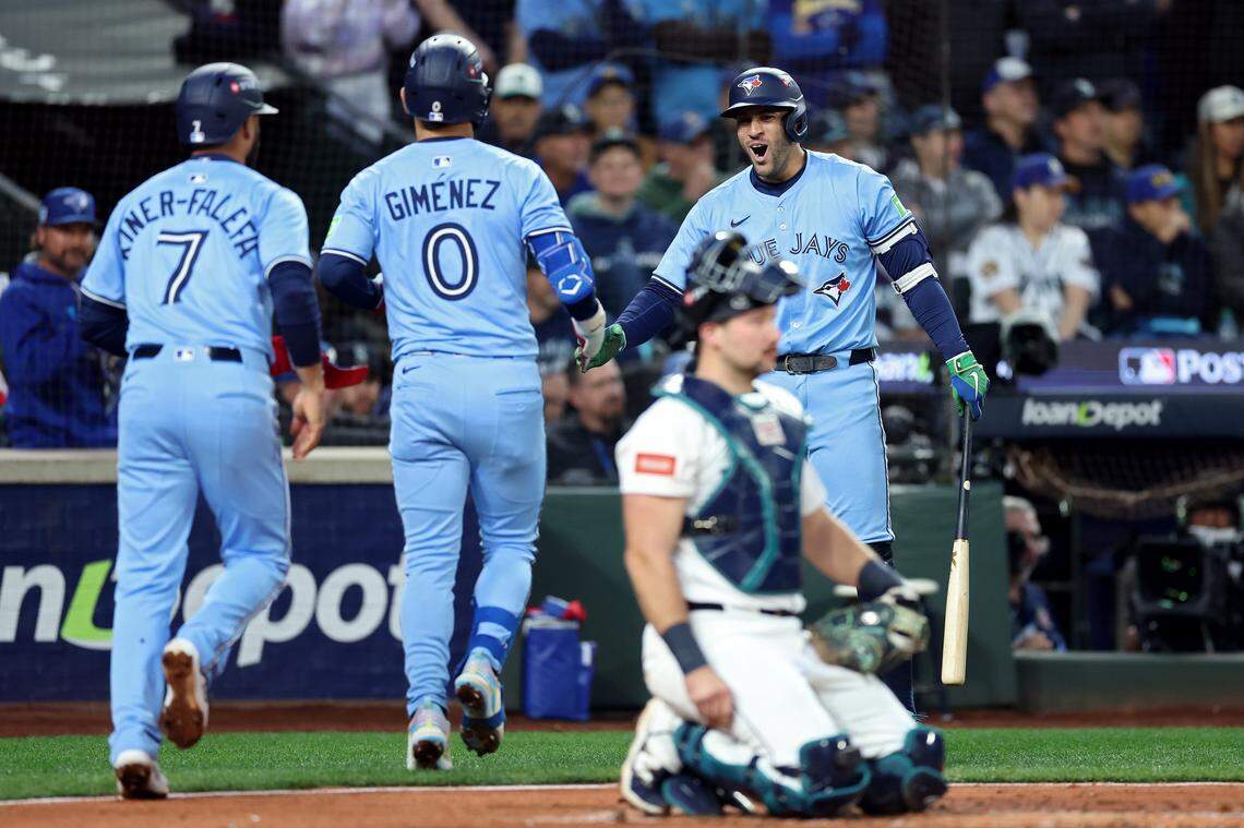 SEATTLE, WASHINGTON - OCTOBER 16: Andres Gimenez #0 of the Toronto Blue Jays celebrates with George Springer #4 after hitting a two-run home run during the third inning against the Seattle Mariners in game four of the American League Championship Series at T-Mobile Park on October 16, 2025 in Seattle, Washington. (Photo by Steph Chambers/Getty Images)