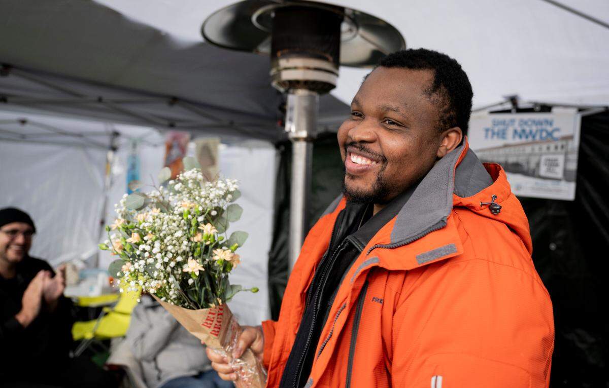 Chidi Emmanuel Megwa of Long Beach, California, is given flowers after being released from the Northwest ICE Processing Center in Tacoma earlier this year.