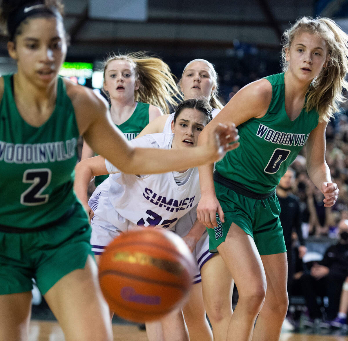 Sumner’s forward Alyson Deaver (33) watches as the ball flies out of her control towards Woodinville’s Veronica Sheffey (2) during the 4A state championship game at Tacoma Dome in Tacoma, Wash. on Saturday, March 5, 2022.