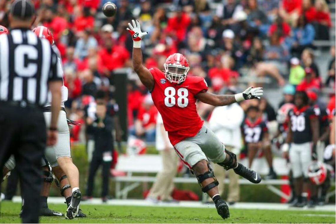 Georgia defensive lineman Jalen Carter reaches for a ball in the second half of Georgia’s spring game, Saturday, April 16, 2022, in Athens. The Seahawks were reportedly hosting Carter for a visit before the 2023 NFL draft.