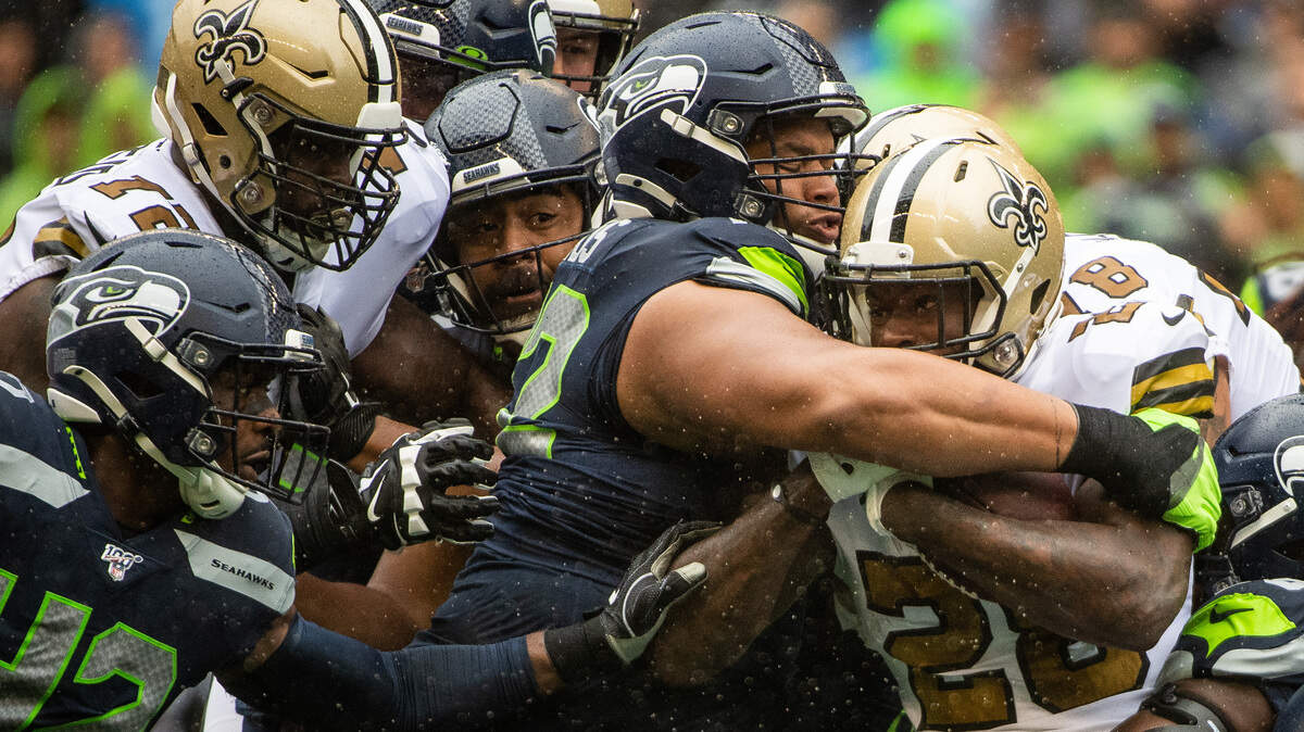 Seattle Seahawks defensive tackle Al Woods (72) tackles New Orleans Saints running back Latavius Murray (28) during the second quarter. The Seattle Seahawks played the New Orleans Saints in a NFL football game at CenturyLink Field in Seattle, Wash., on Saturday, Sept. 21, 2019.